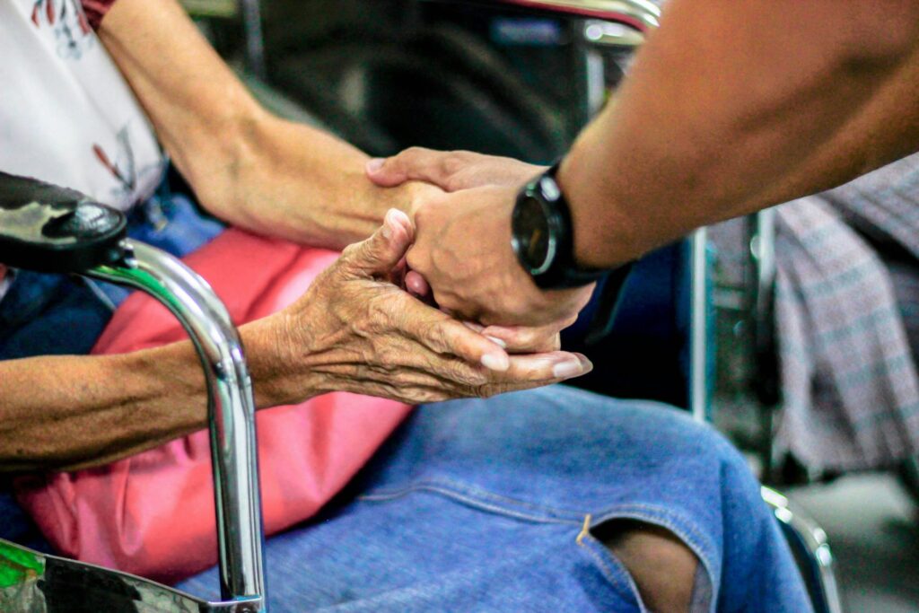 A caring hand held during a difficult moment